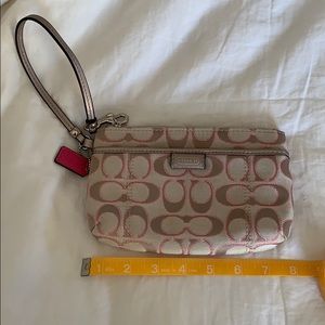 Pink and tan coach wristlet